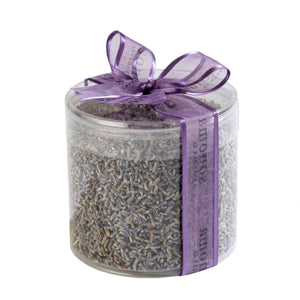 2oz of Sonoma Lavender buds displayed in a clear round container, showcasing the vibrant purple hues and natural texture of the dried lavender buds.