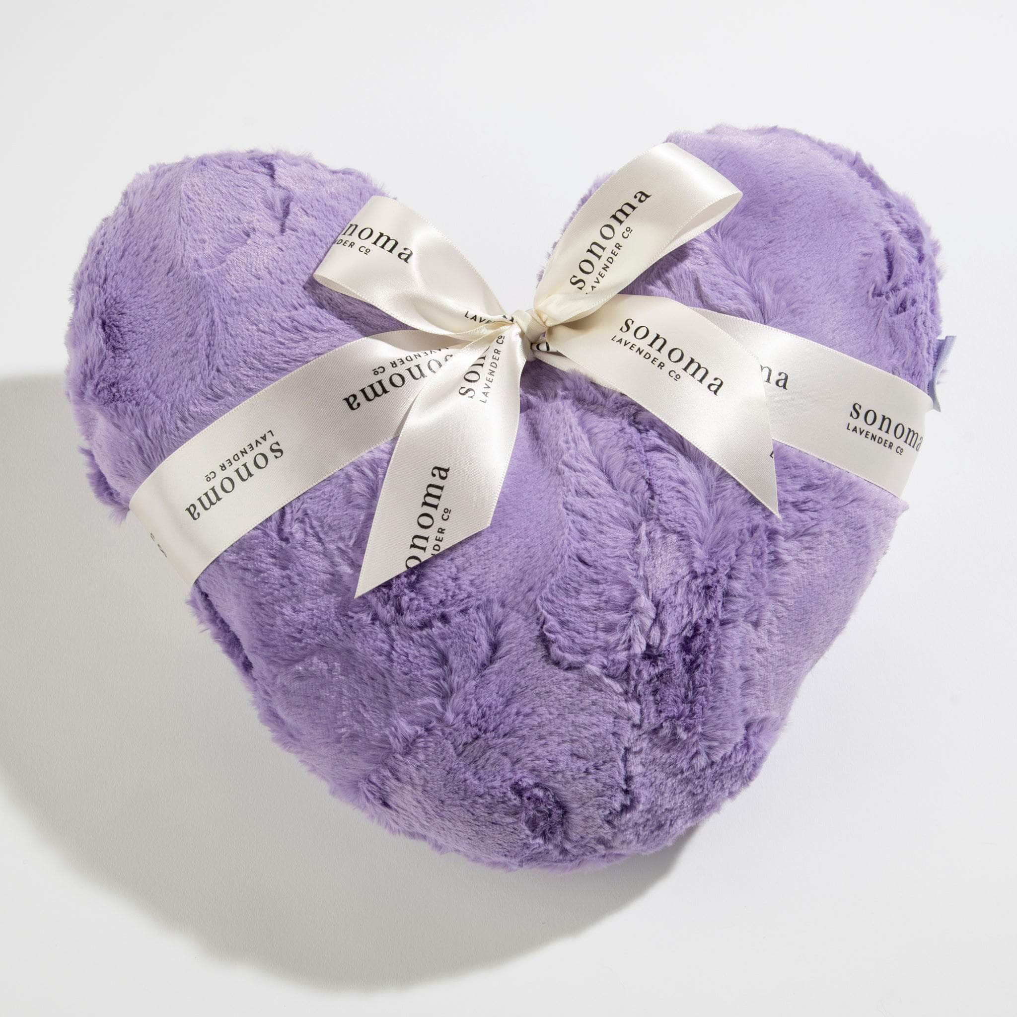 Cozy up to comfort with our 12” Lavender Warm Heart Pillow. Filled with calming lavender, it provides soothing warmth and relaxation—perfect for your at-home spa experience.