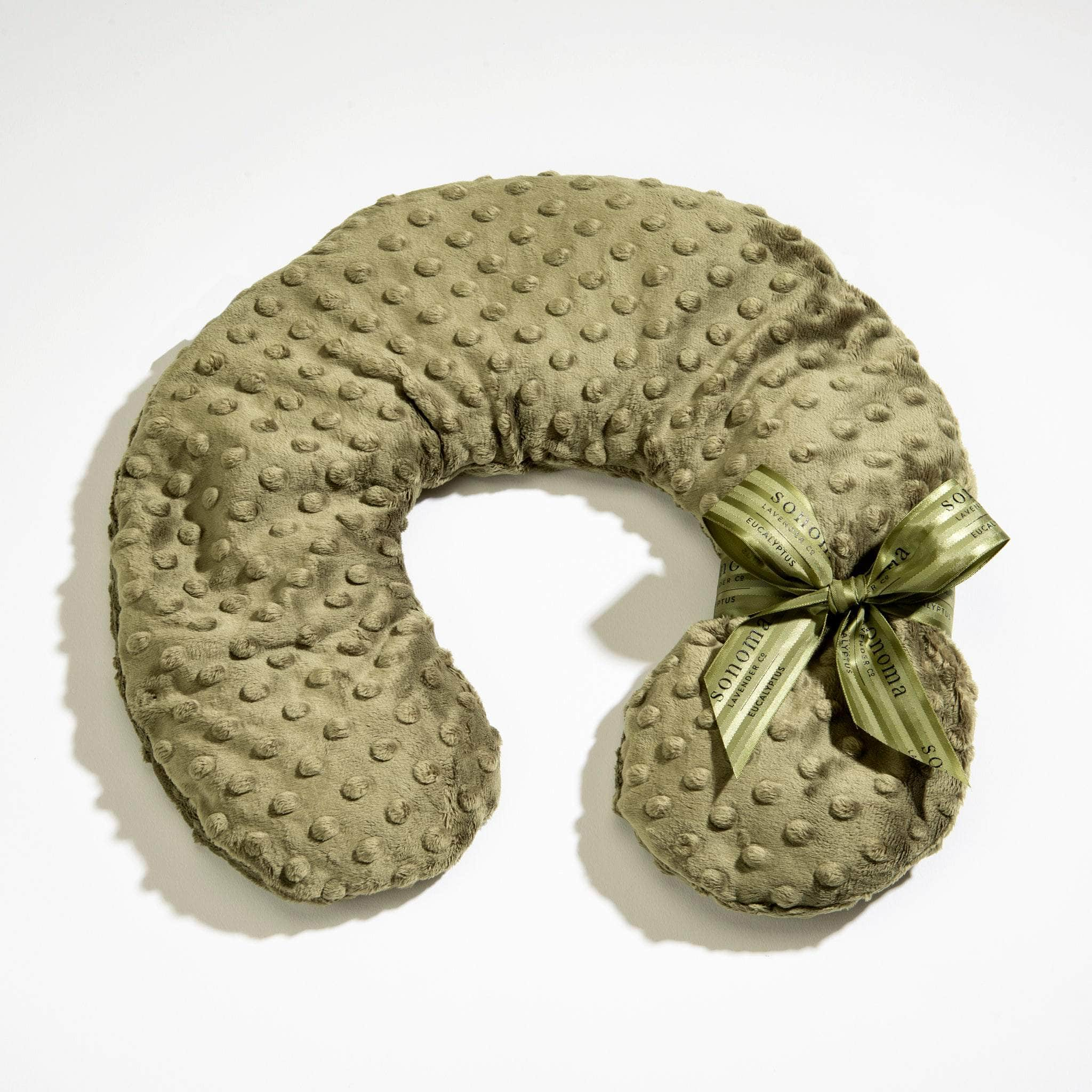 Heatable/chillable Eucalyptus Neck Pillow in Green Dot fabric—soothing comfort for relaxation at home.