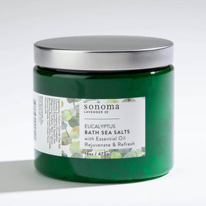 Eucalyptus Infused Bath Salts in a glass jar, offering a refreshing and soothing spa-like soak.